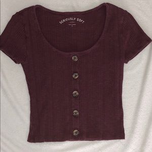 Purple button up shirt.